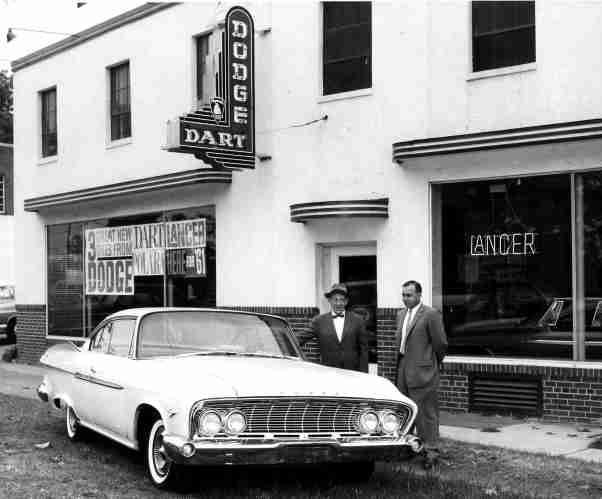 1961 - New car show time. Lewis Reed (left) and James Gartner, Salesman