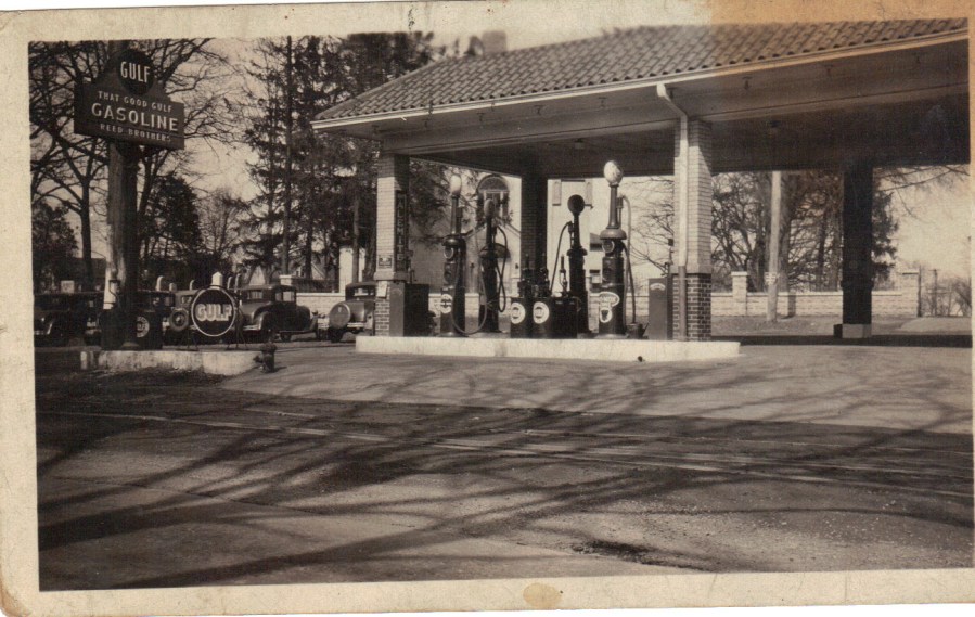 Late 1920's. In front is a large sign that reads "That Good Gulf