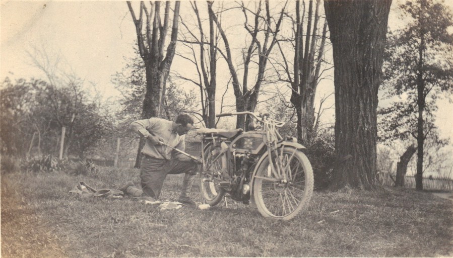 Lewis Reed repairing motorcycle