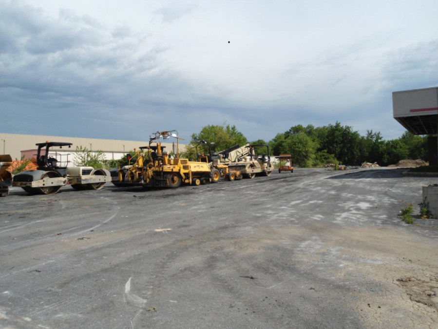 Heavy equipment parked on side lot