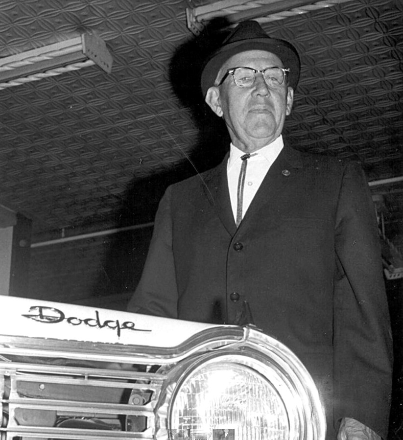 Lewis Reed in the new car showroom, 1965