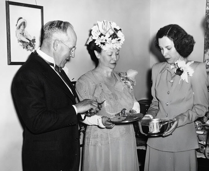 Mary Jane Reed with her parents at wedding reception.